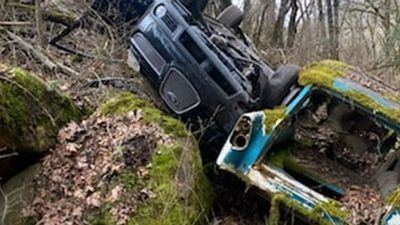 Image for story: Car crashes off Oregon road - and onto wreckage of another car from a bygone era