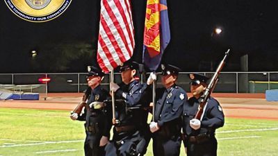 Image for story: Former police officer stands for national anthem for first time in almost 14 years