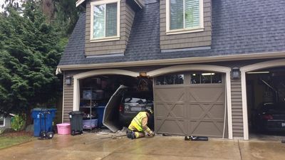 Image for story: Uh-oh: Teen training with mom drives through garage door