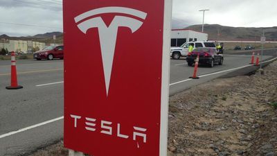 Image for story: Tesla shares slip after company decides to stay public