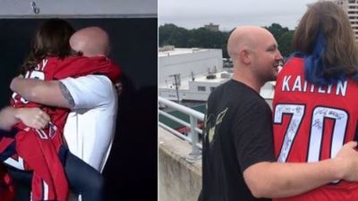 Image for story: Navy father and young daughter reunited and cheering on the Capitals together