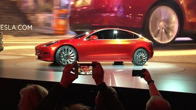 Image for story: On the road to make an affordable car, Tesla cuts jobs