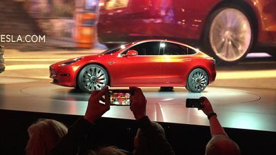 Image for story: On the road to make an affordable car, Tesla cuts jobs