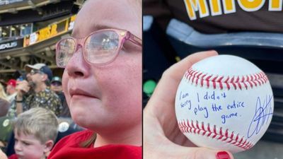 Image for story: Young Reds fan, saddened by Votto's ejection from game, given signed ball by player