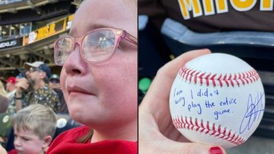 Image for story: Young Reds fan, saddened by Votto's ejection from game, given signed ball by player