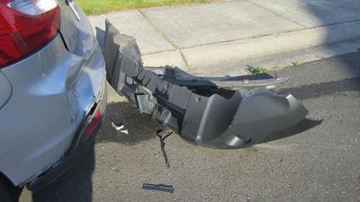 Image for story: Going to smash into your neighbor's car while drunk? Don't leave your license plate behind