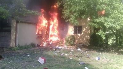 Image for story: Fire officials: Man sets house on fire, flees scene, crashes into tree in Maryland