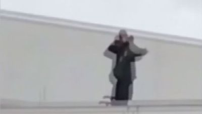 Image for story: Security guard caught on video pretending to shoot students