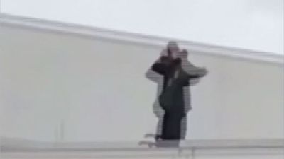 Image for story: Security guard caught on video pretending to shoot students