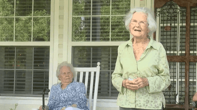 Image for story: Drive-thru parade celebrates woman's 102nd birthday