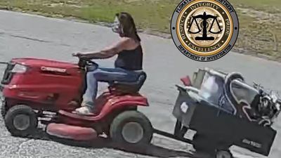 Image for story: Wanted in Alabama: Masked woman steals lawnmower, trailer, Crimson Tide yard sign