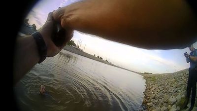 Image for story: BODY CAM: Suspect attempts to swim away from officers following pursuit