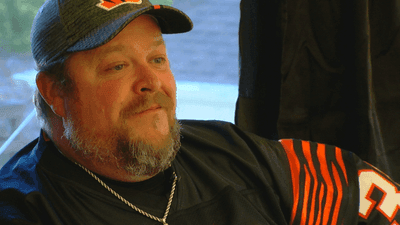 Image for story: Bengals fan enters second month living on roof after pledging to stay until a win 