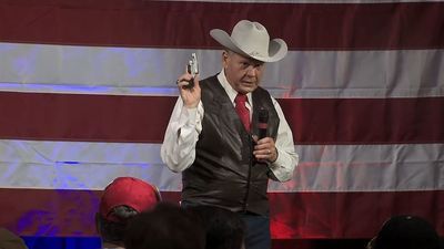 Image for story: Roy Moore reported to police by TV viewer for pulling out handgun at rally