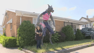 Image for story: 'My house mascot': Ohio woman refusing to take down 10-foot tall werewolf decoration