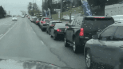 Image for story: Vehicles line up for drive-thru COVID-19 testing in Birmingham, Alabama