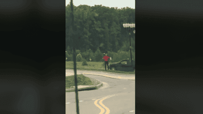 Image for story: Dedicated fast food employee sprints after customer to deliver forgotten food