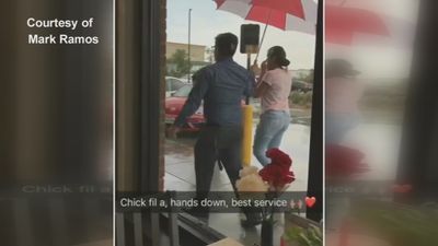 Image for story: Video of Chick-Fil-A employee holding umbrella for customers goes viral