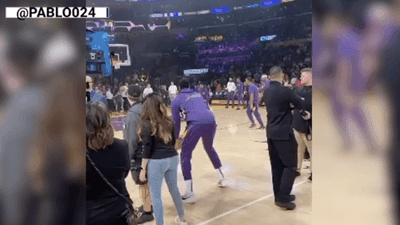 Image for story: LeBron James and Anthony Davis pretend to play football