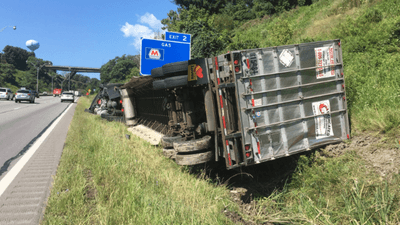 Image for story: Semi carrying 40,000 pounds of Hershey products rolls onto side in West Virginia