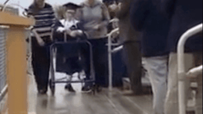 Image for story: High school graduate with cerebral palsy walks graduation stage despite coronavirus