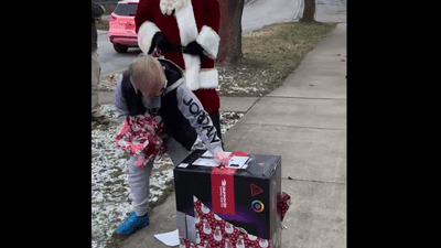 Image for story: Police give boy amazing Christmas gift after he wrote letter asking Santa to help his dad