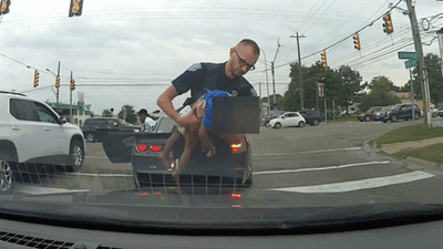 Image for story: VIDEO: 18-month-old child struggling to breathe saved by officer during traffic stop