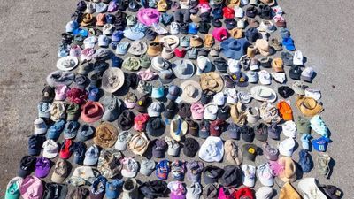 Image for story: 438 hats found inside hot springs at Yellowstone National Park