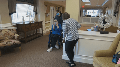 Image for story: Separated by COVID, sisters hug for the first time in a year