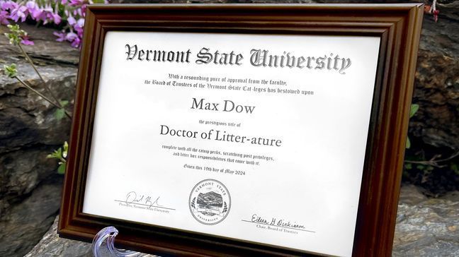 This photo provided by Vermont State University shows a special diploma for Max the Cat at Vermont State University Castleton on Oct. 12, 2023 in Castleton, Vt.  Vermont State University's Castleton campus has bestowed the title of âDoctor of Litter-atureâ on Max, a beloved member of its community, ahead of students' graduation on Saturday. The school is not honoring the feline for his mousing or napping but rather for friendliness. (Rob Franklin/Vermont State University via AP)