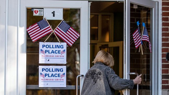 FILE- A voter arrives to cast their ballot in the midterm elections, Nov. 8, 2022, at Southside Elementary School in Huntington, W.Va. (Sholten Singer/The Herald-Dispatch via AP)