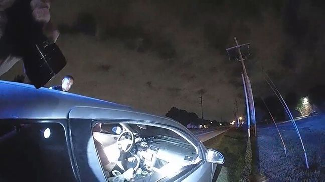 This still image from video provided Monday, Sept. 14, 2020, by the Tulsa Police Department shows the encounter of two officers with David Ware after a traffic stop in the overnight hours June 29. The video shows Officer Aurash Zarkeshan and Sgt. Craig Johnson trying to get Ware out of the car, and Ware shooting the officers during a struggle.