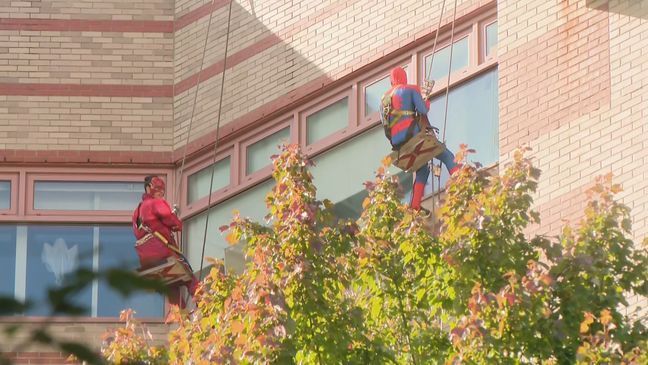 Window cleaners put smiles on children's faces when they dressed up as superheroes to clean the windows at Hasbro Children's Hospital in Rhode Island. (WJAR) 