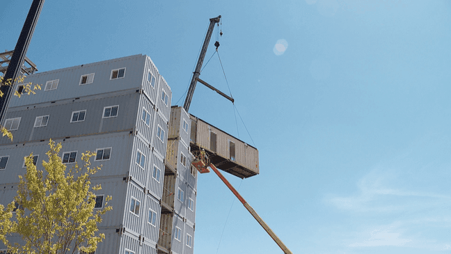 Friday, the final piece was put into place on a six-story apartment complex in Salt Lake City built solely out of shipping containers. (Photo: Mark Less, KUTV)