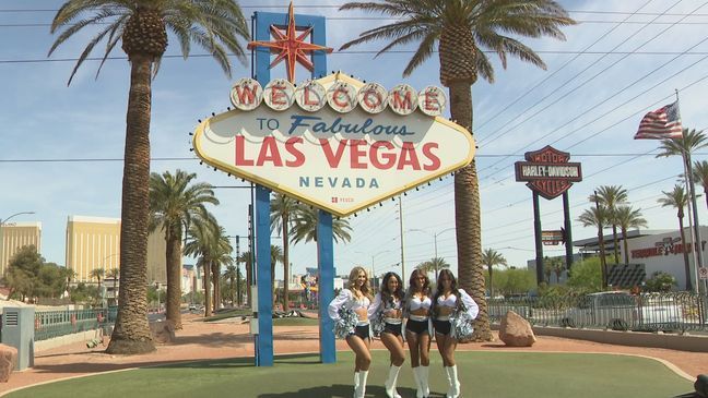 Members of the Raiderettes pose for a photo in front of the "Welcome to Las Vegas" sign ahead of the 2022 NFL Draft. (Photo: KSNV)