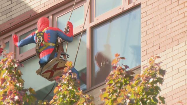 Window cleaners put smiles on children's faces when they dressed up as superheroes to clean the windows at Hasbro Children's Hospital in Rhode Island. (WJAR) 