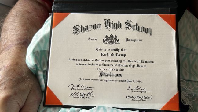 98-year-old Richard Remp receives a high school diploma, 71 years after he dropped out of high school to fight the Nazis during World War II. (WJLA) 