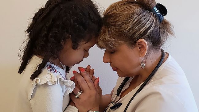 This undated photo shows Katherine Ramos, right, with her 4-year-old daughter Victoria Ramos at their home in Patterson, N.Y. Ramos is one of an army of health care workers that heeded New York's call for help reinforcing hospitals overwhelmed by the coronavirus pandemic.{&nbsp;} (James Ramos via AP)