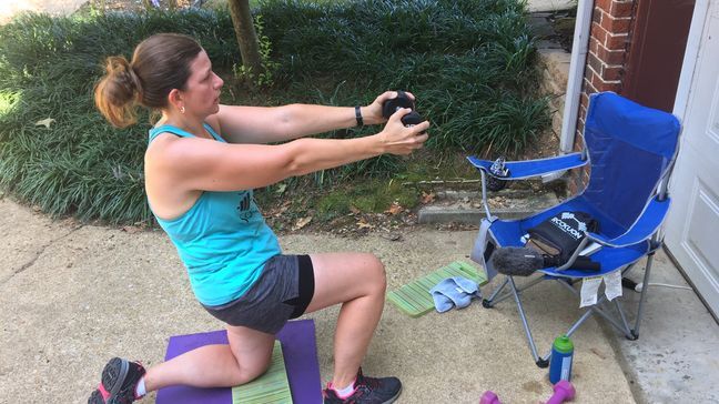 Jessica Rasnic working out to Bootcamp by Rebecca in her driveway. (Image: WTVC){p}{/p}