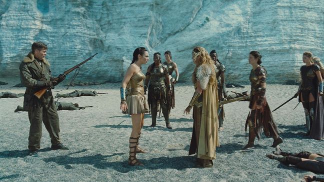 (Forefront L-R) CHRIS PINE as Steve Trevor, GAL GADOT as Diana and CONNIE NIELSEN as Hippolyta in the action adventure "WONDER WOMAN," a Warner Bros. Pictures release. (Clay Enos/ TM & © DC Comics)