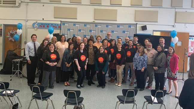 Teachers were presented with a special Little Kids Rock shirt, and examples of the instruments schools would receive were also available at the event for the teachers and school administrators to play around with after the announcement. (Image: WTVC)