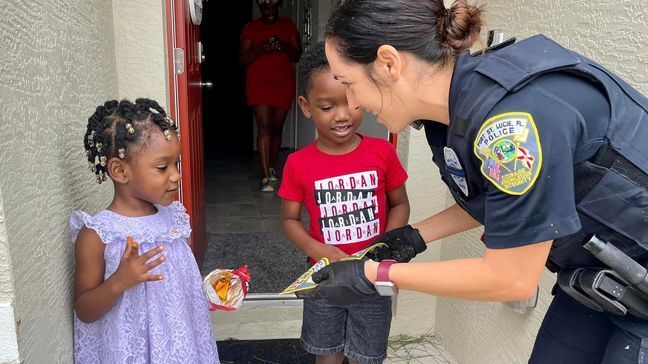 Nayle,{&nbsp;} 3, and Jaylen,{&nbsp;} 4, were all smiles when they met the officers and got their own patches, Sept.{&nbsp;} 29,{&nbsp;} 2022.{&nbsp;} (Port St. Lucie Police Dept.)