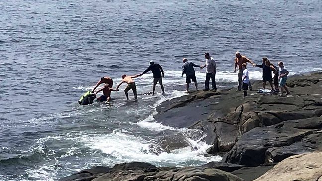 A York town employee jumped into the water near Nubble Light to save a diver from drowning Monday. (Lois Griswold)