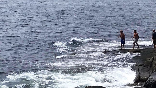 A York town employee jumped into the water near Nubble Light to save a diver from drowning Monday. (Lois Griswold)