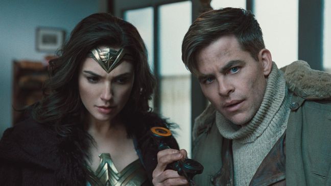 (L-R) GAL GADOT as Diana and CHRIS PINE as Steve Trevor in the action adventure "WONDER WOMAN," a Warner Bros. Pictures release. (Clay Enos/ TM & © DC Comics)