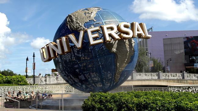 In this Thursday, Oct. 22, 2015 photo, park guests relax in the shade of rotating globe at Universal Studios in Orlando, Fla. (AP Photo/John Raoux)