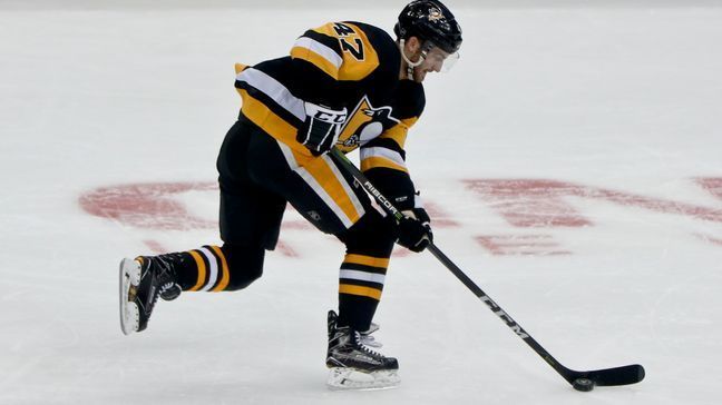 FILE - Pittsburgh Penguins' Adam Johnson plays against the Columbus Blue Jackets during an NHL preseason hockey game, Saturday, Sept. 22, 2018, in Pittsburgh. (AP Photo/Keith Srakocic, File)