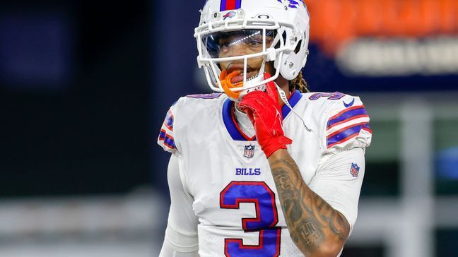 FILE - Buffalo Bills safety Damar Hamlin (3) adjusts his chin strap during the second half of an NFL football game against the New England Patriots, Thursday, Dec. 1, 2022, in Foxborough, Mass. The Bills are taking it slowly with safety Damar Hamlin, who is being held back from participating in the teamâs first week of voluntary practices some five months after having a near-death experience on the field, coach Sean McDermott said on Tuesday, May 23, 2023. (AP Photo/Greg M. Cooper, File)