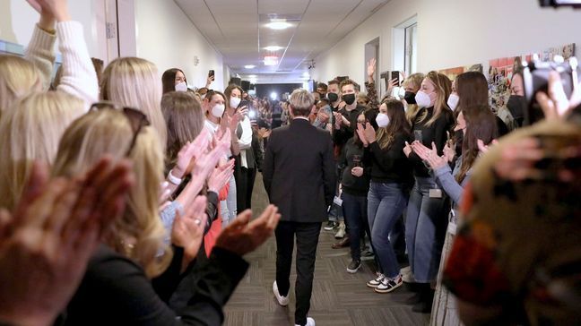 In this photo released by Warner Bros., talk show host Ellen DeGeneres is applauded during the taping of "The Ellen DeGeneres Show" at the Warner Bros. lot in Burbank, Calif. (Michael Rozman/Warner Bros. via AP)