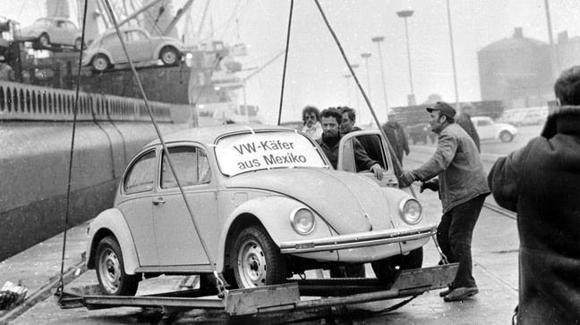 FILE - In this Dec. 18, 1977 file photo, a Volkswagen Beetle is unloaded at Emden harbor, Germany, as the first shipment of 1600 Beetles made in Mexico arrives. Volkswagen is halting production of the last version of its Beetle model in July 2019 at its plant in Puebla, Mexico, the end of the road for a vehicle that has symbolized many things over a history spanning eight decades since 1938. (AP Photo/Heinz Ducklau, file)